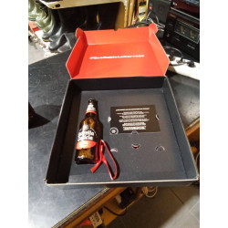 CAJA CON BOTELLA ESTRELLA...
